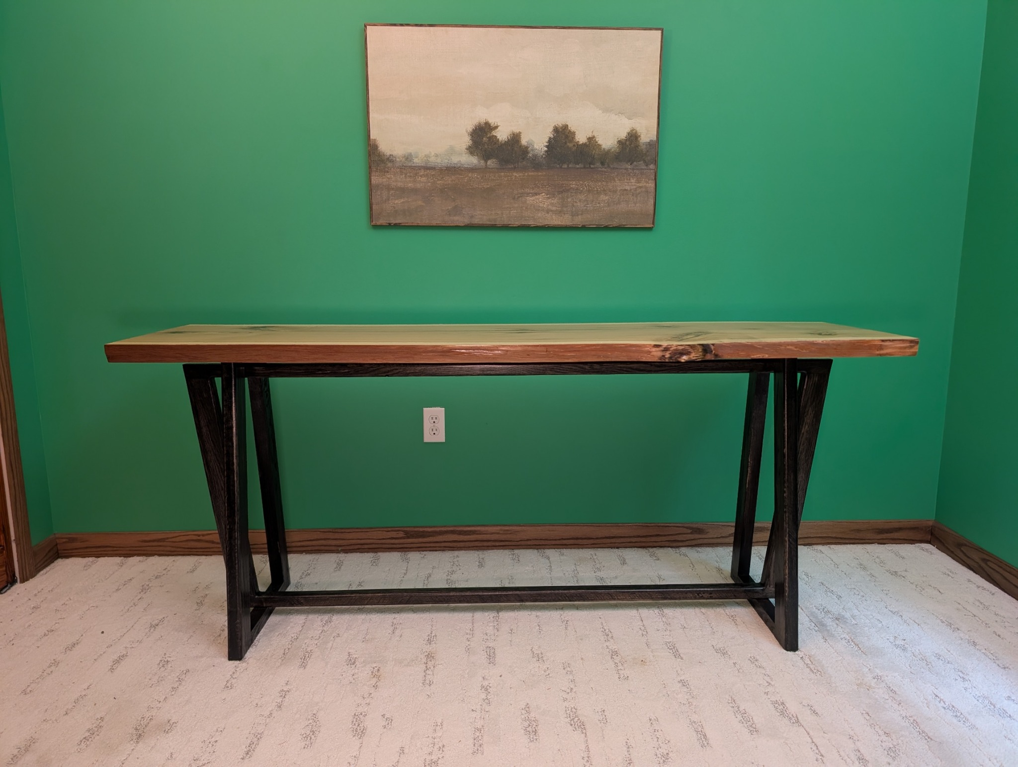 Straight-on view of the hickory console and its three interlocking trapezoids