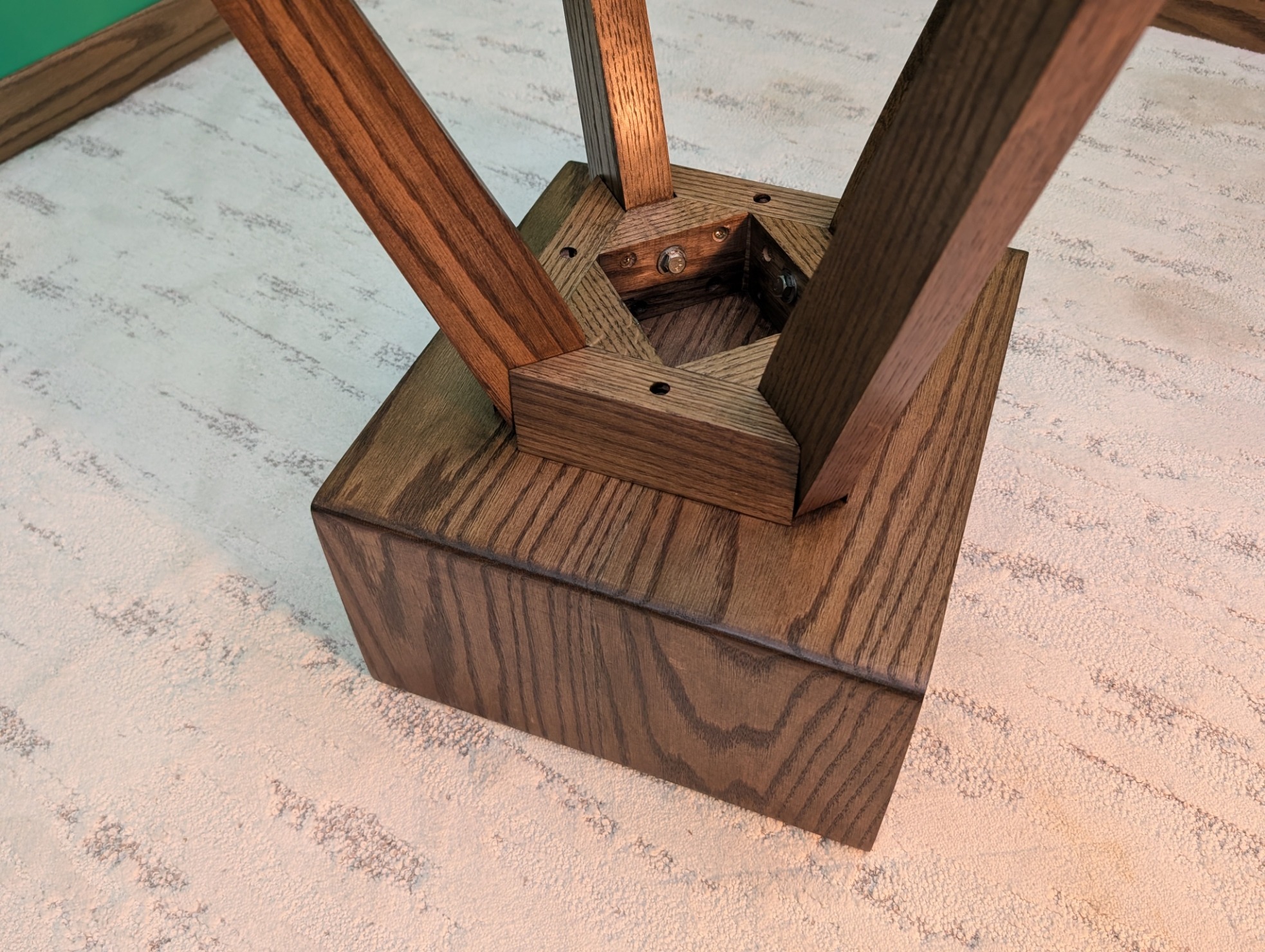 Underside view showing the fitted base structure and splayed-leg joinery